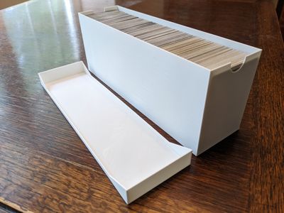 Trading card container aside the container top.